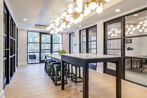 a large dining room with a long table and chairs